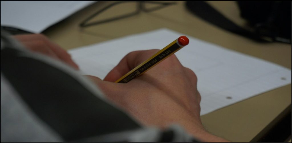 Hand writing to paper 