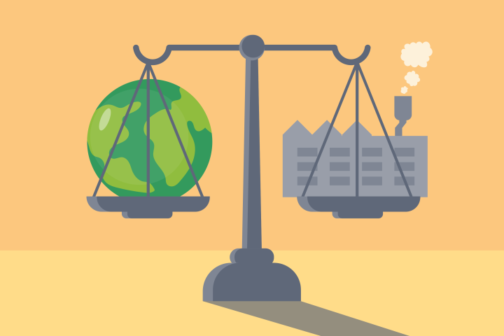 Vaaka, jossa toisessa kupissa maapallo ja toisessa tehdasrakennus