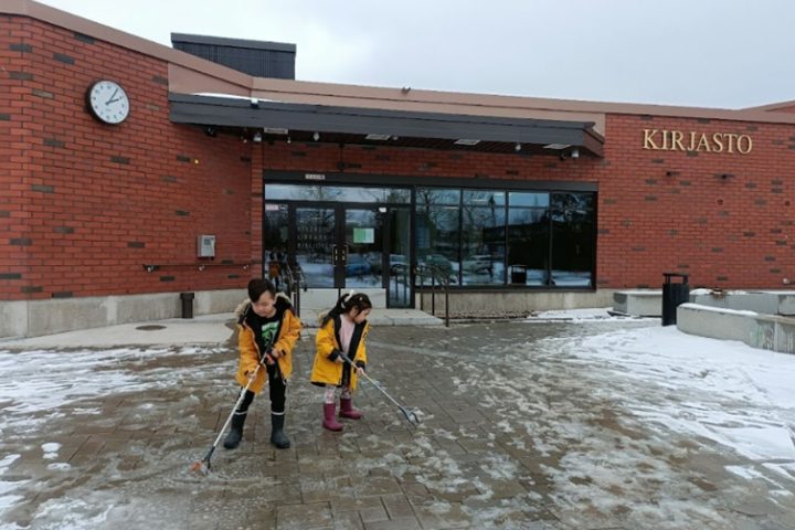 two persons plogging in front of library building